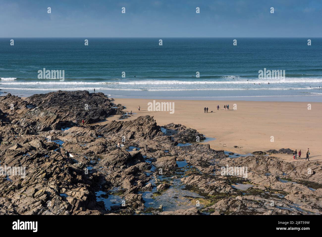 Rocks in the littoral zone exposed at low tide on Fistral Beach in ...