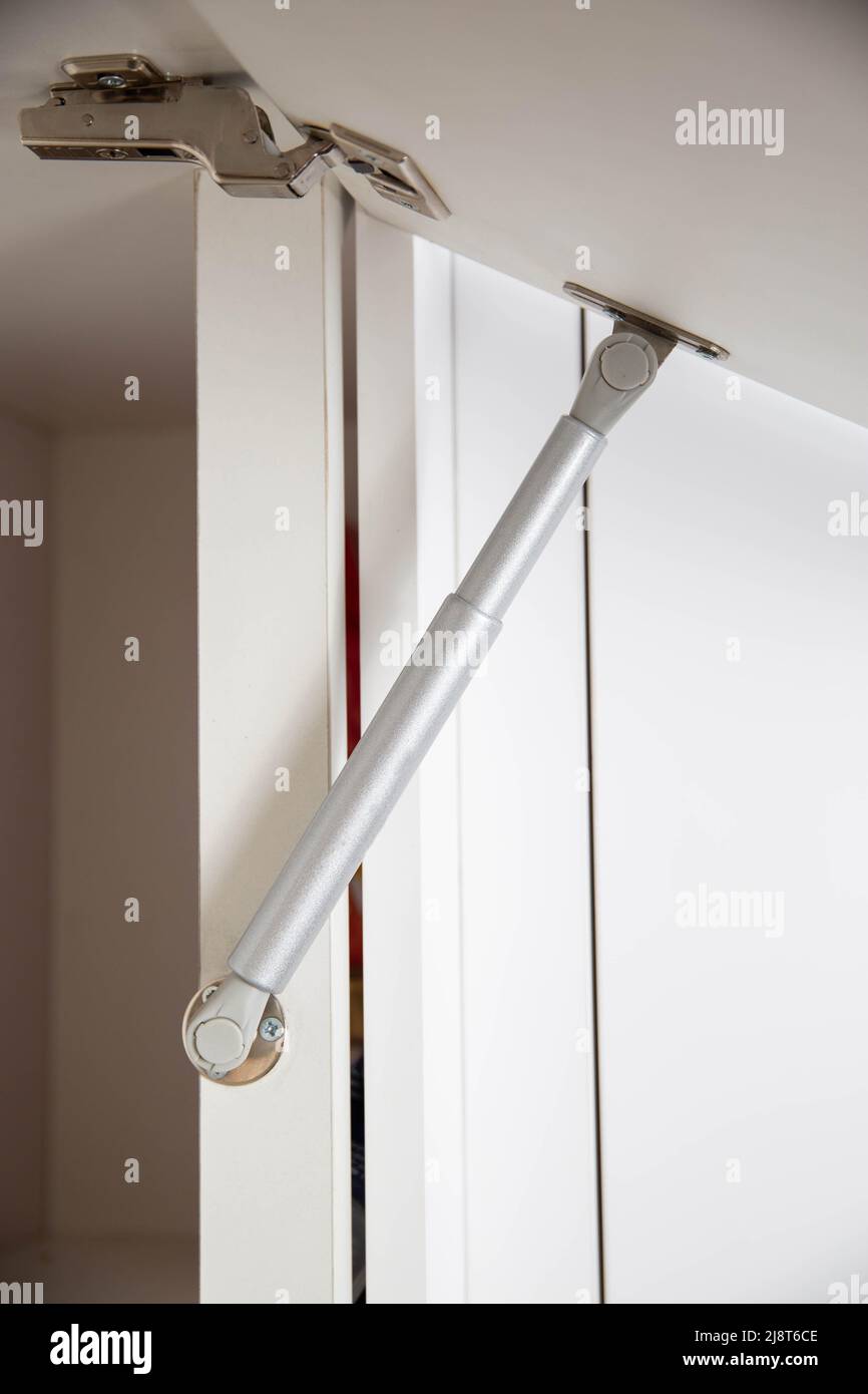 Retractable gas shock absorber for opening the drawer in the kitchen