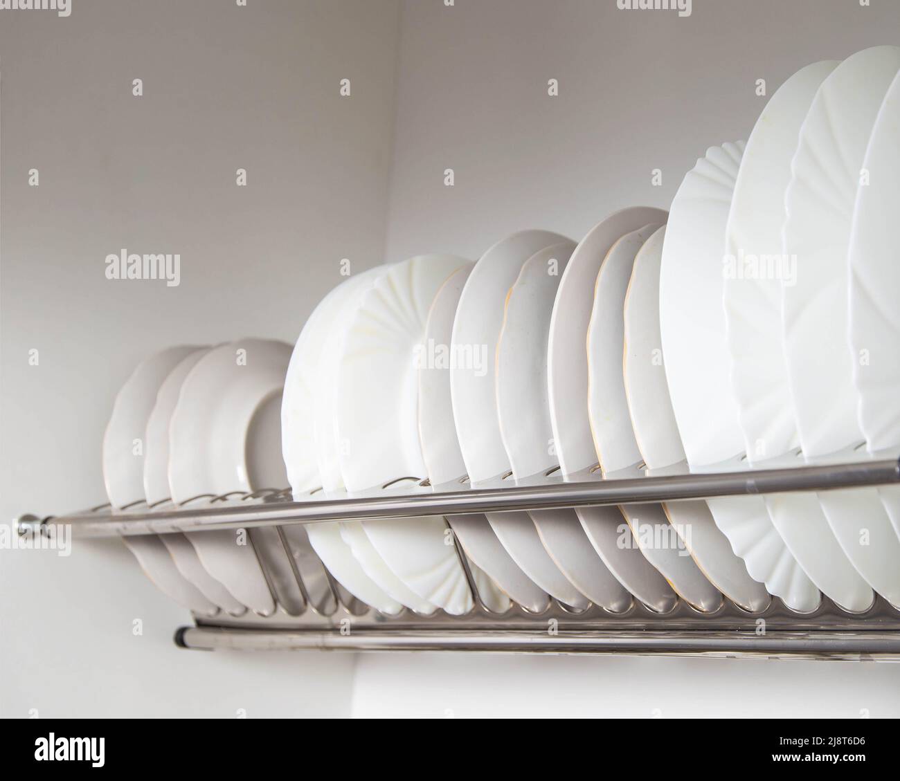 Storage of clean dishes in a separate kitchen section with a lifting