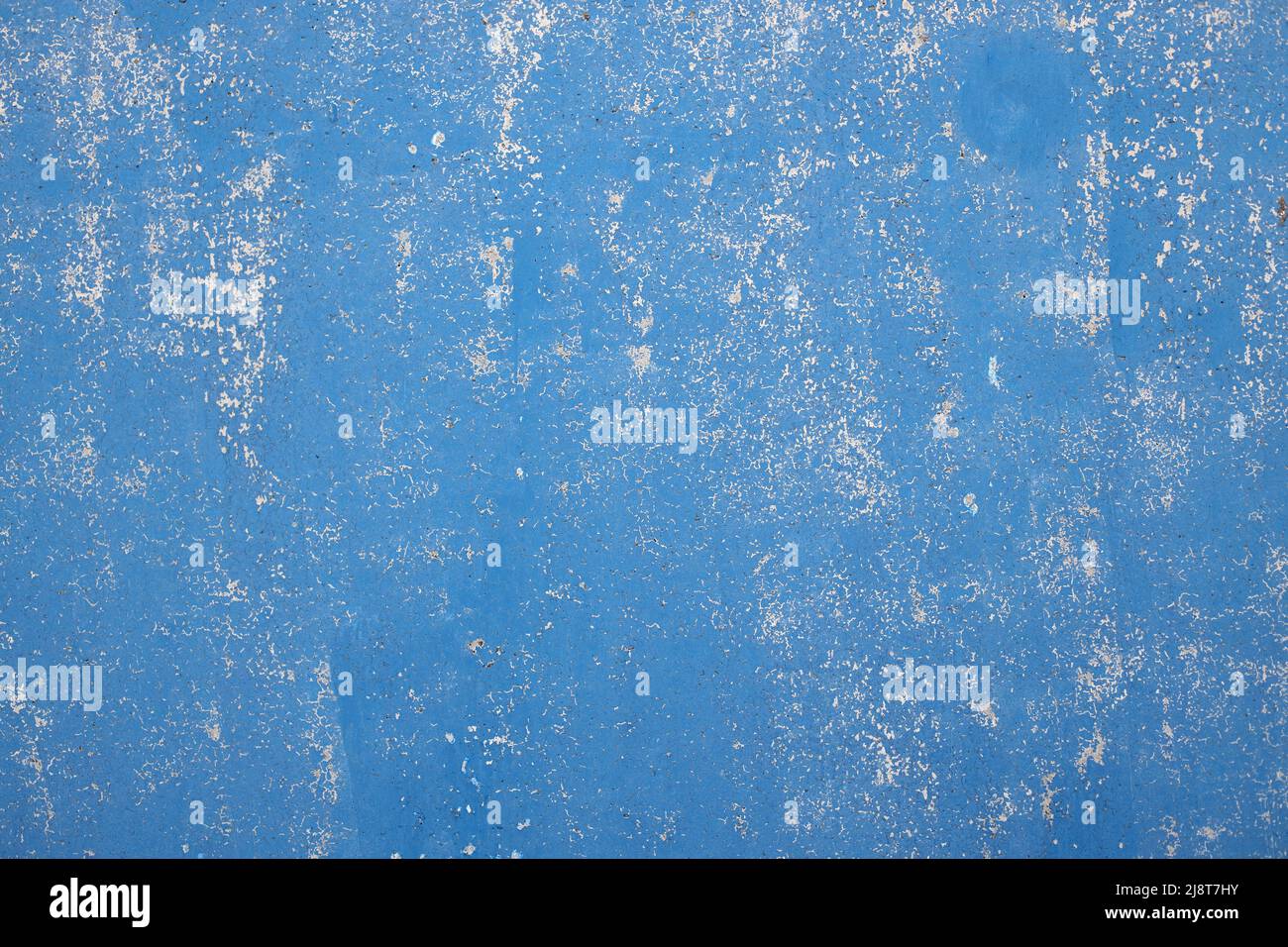 Abstract background is blue. Concrete wall with cracked and rough surface. Stock Photo