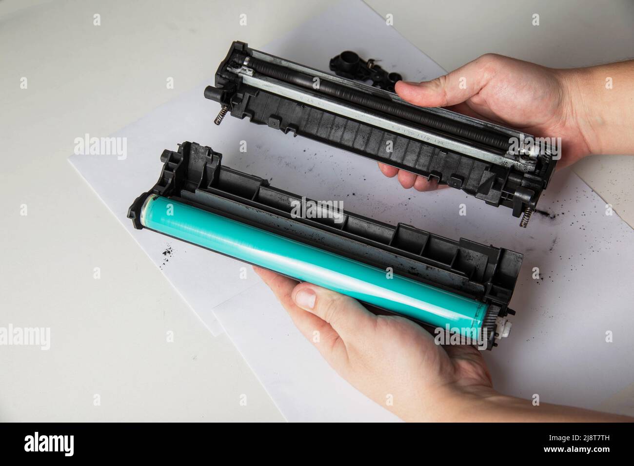 Disassembly of the printer cartridge for its maintenance and refilling with  toner. White background Stock Photo - Alamy