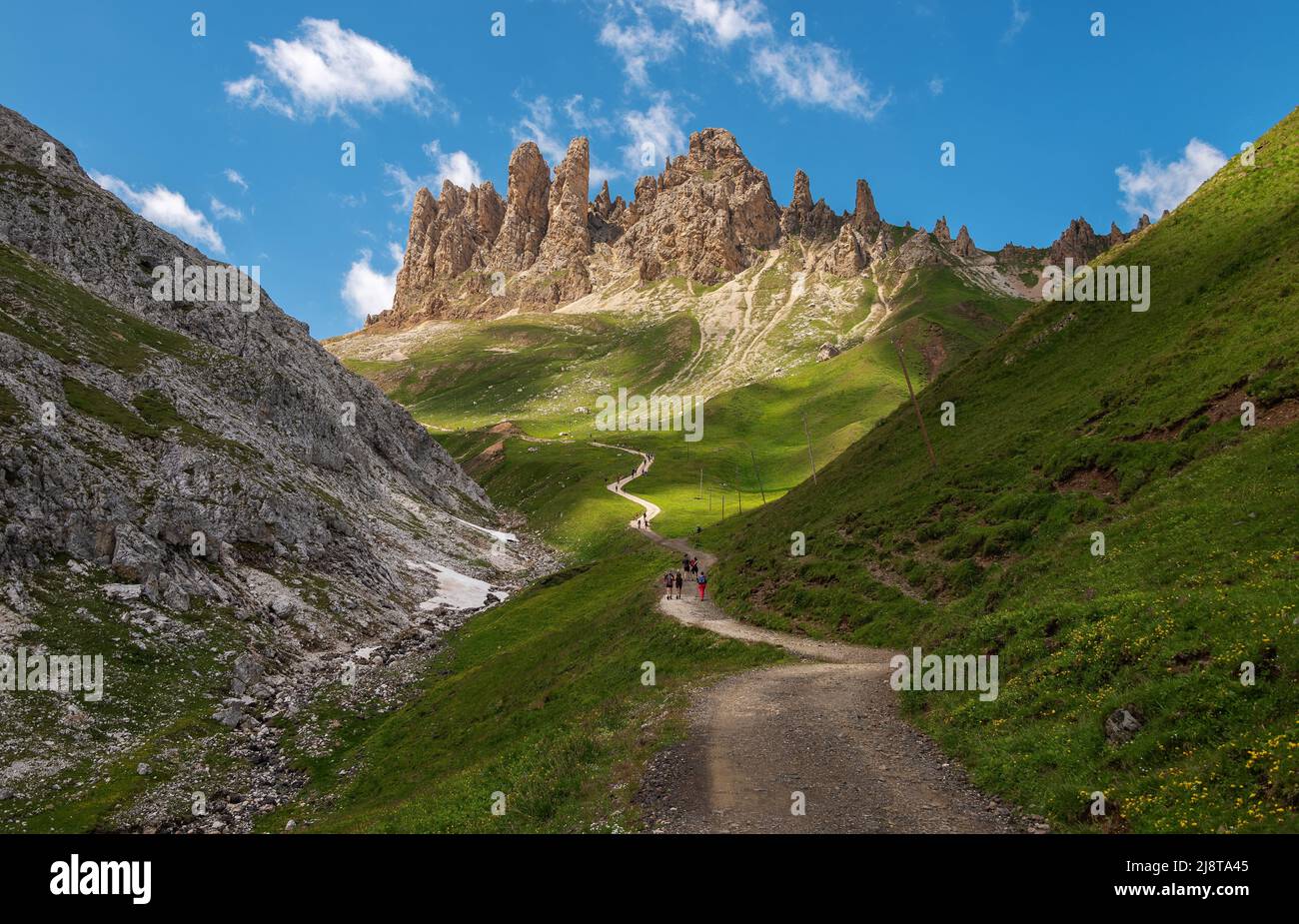 Hiking in the meadows of the Dolomites mountains in Italy Stock Photo ...