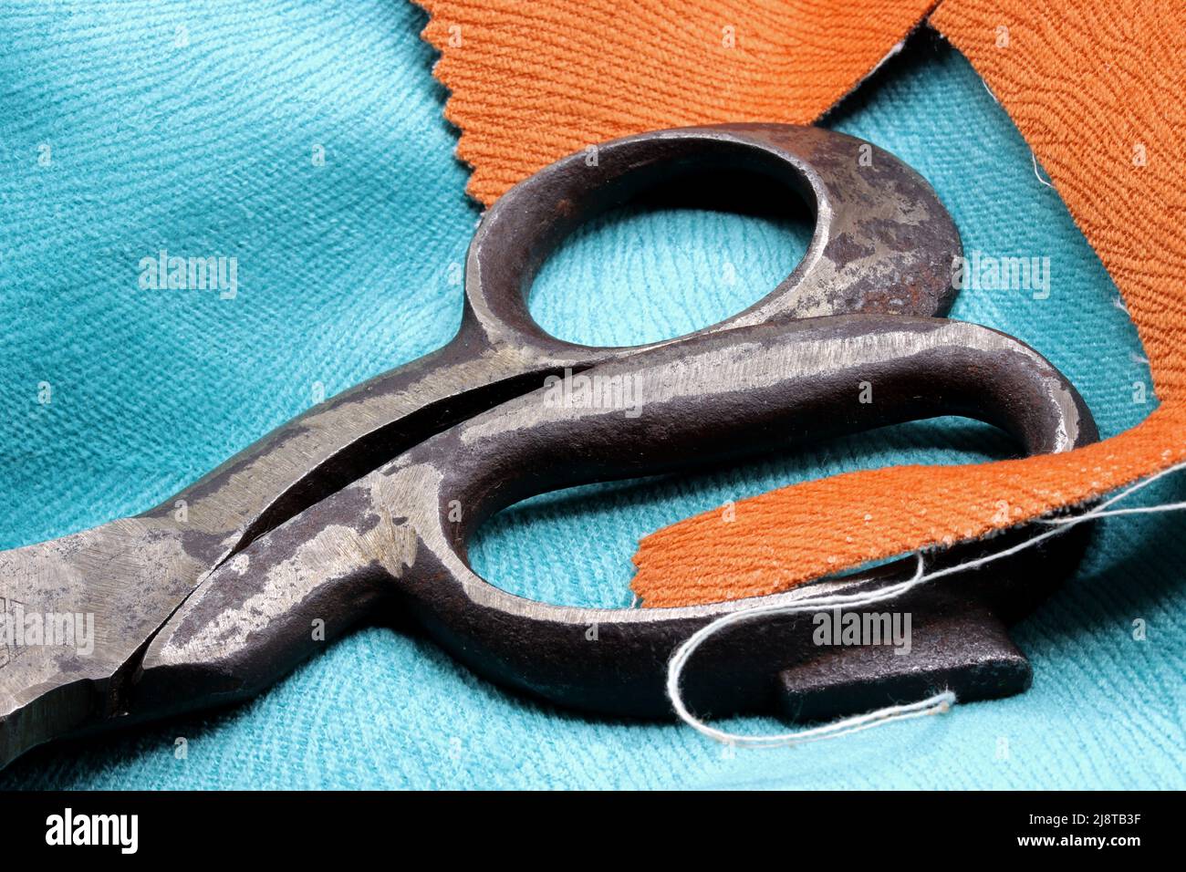 Old tailor scissors on fabric background stock photo Stock Photo - Alamy