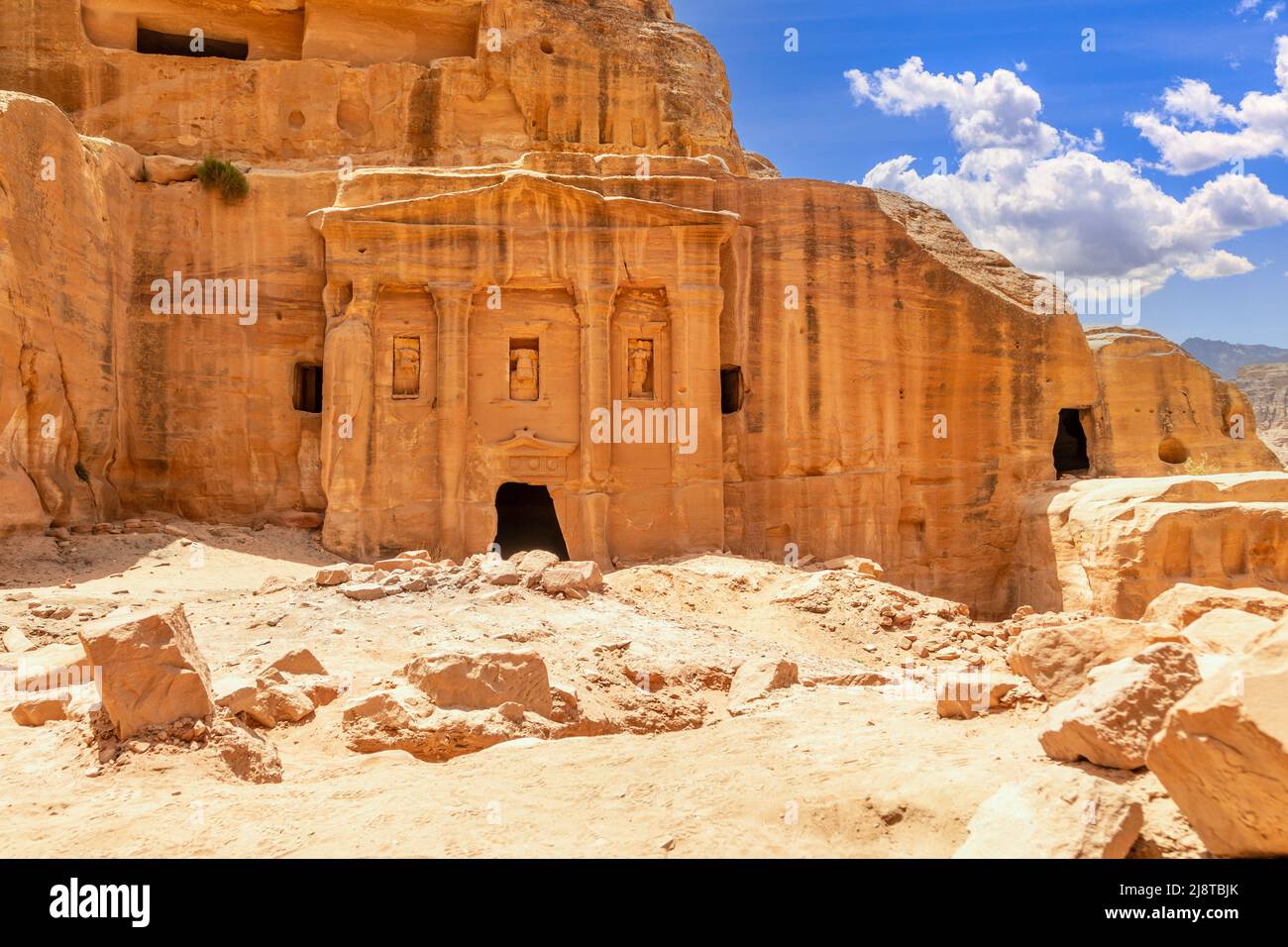 Ancient tomb of Roman soldier and funeral ballroom carved in sandstone rock, Petra, Jordan Stock Photo