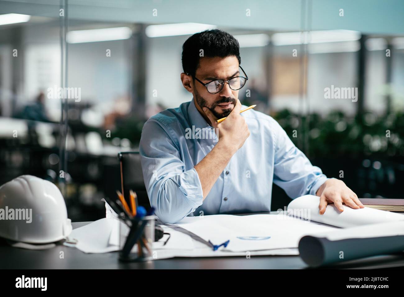Serious busy smart handsome millennial middle eastern man engineer with ...