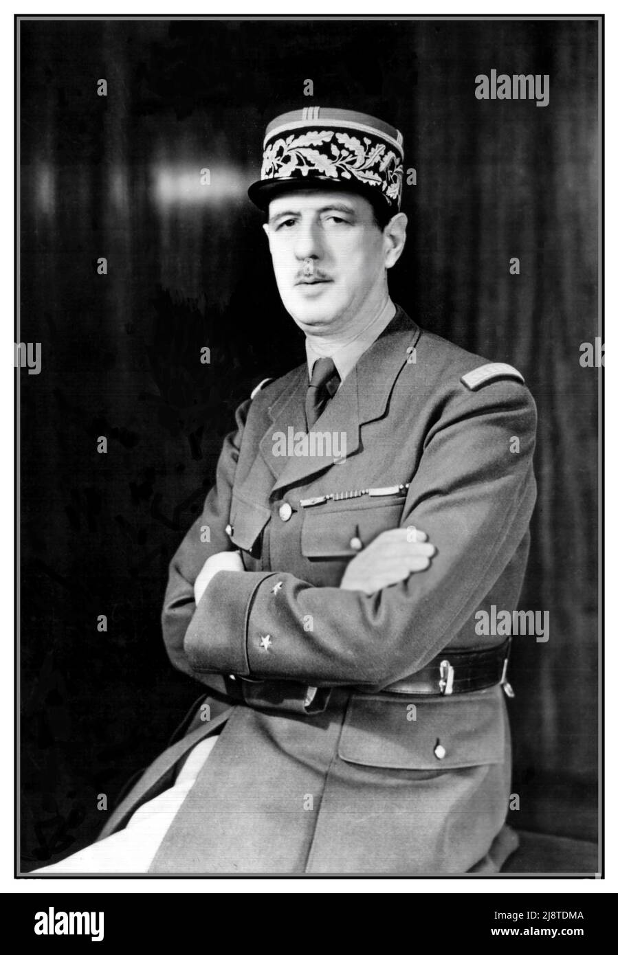 WW2 French General Charles De Gaulle formal portrait in military uniform and cap. A WWII photo portrait of General Charles de Gaulle of the Free French Forces and first president of the Fifth Republic serving from 1959 to 1969. Date circa 1942 World War II Second World War Stock Photo