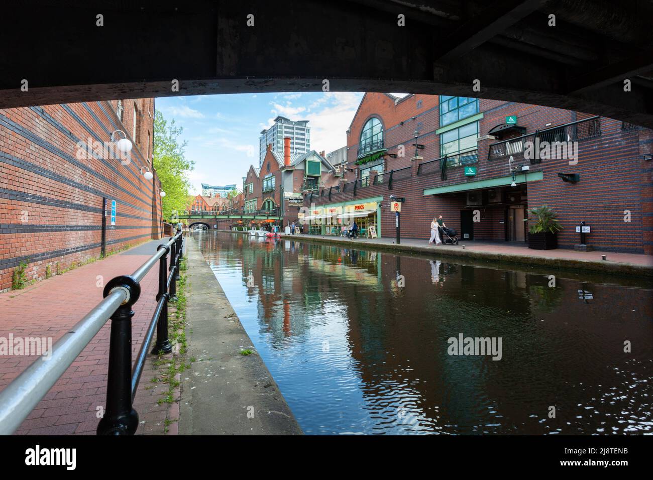 View of a canal under a bridge, Birmingham city centre, UK 2022 Stock