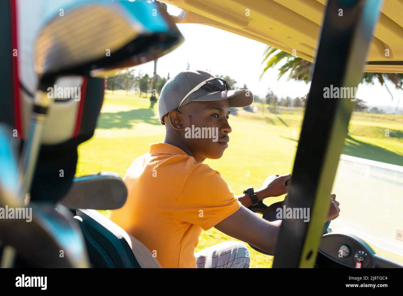 African american young man wearing cap and sunglasses looking away
