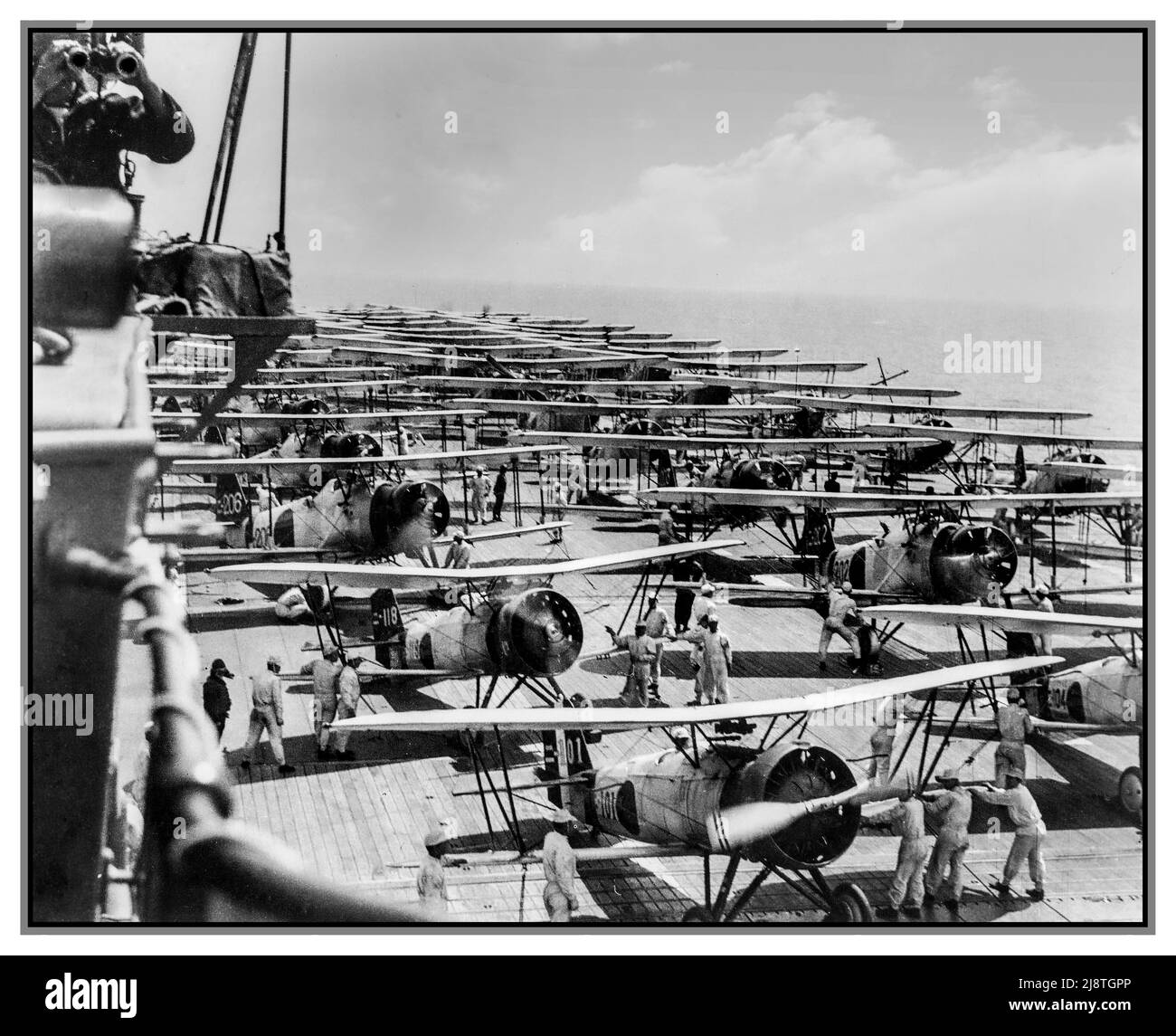 PEARL HARBOR REHEARSAL Imperial Japanese Navy aircraft carrier Kaga conducts air operations in 1937. On the deck are Mitsubishi B2M Type 89, Nakajima A2N Type 90, and Aichi D1A1 Type 94 aircraft. Stock Photo