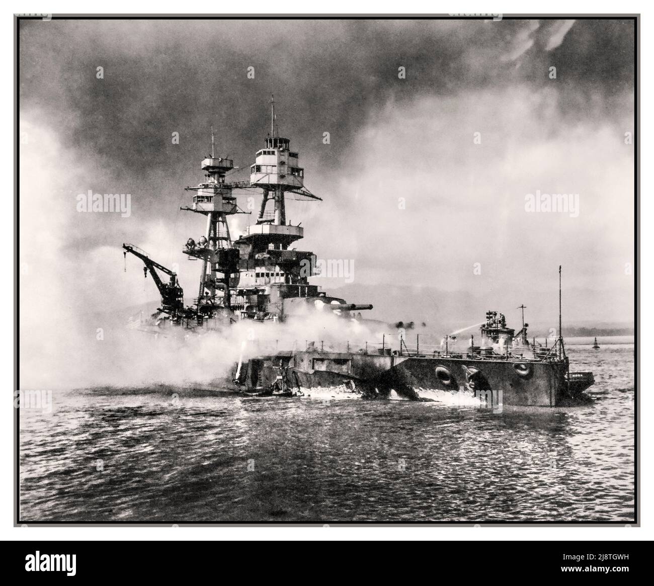 Pearl Harbor Attack USS NEVADA ,WW2 starts for USA December 7, 1941. USS Nevada (BB 36) burning during the Japanese aerial attack. Official U.S. Navy Photograph,  WW2 Hawaii USA America Stock Photo