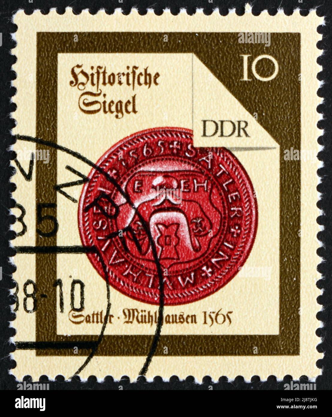 GDR - CIRCA 1988: a stamp printed in GDR shows Muhlhausen Saddler, Seal from 1565, circa 1988 Stock Photo