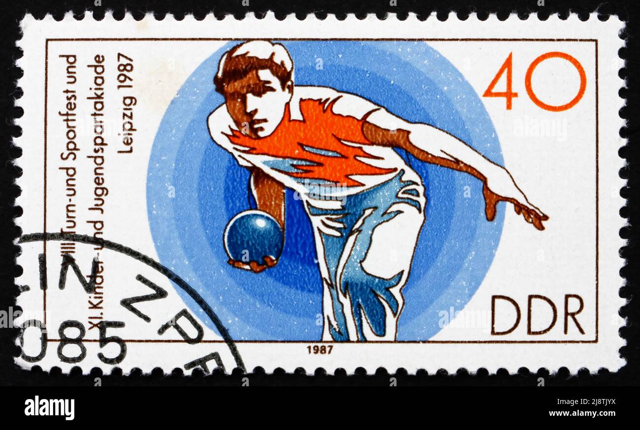 GDR - CIRCA 1987: a stamp printed in GDR shows Bowling, 11th Children’s and Youths’ Spartakiade, circa 1987 Stock Photo