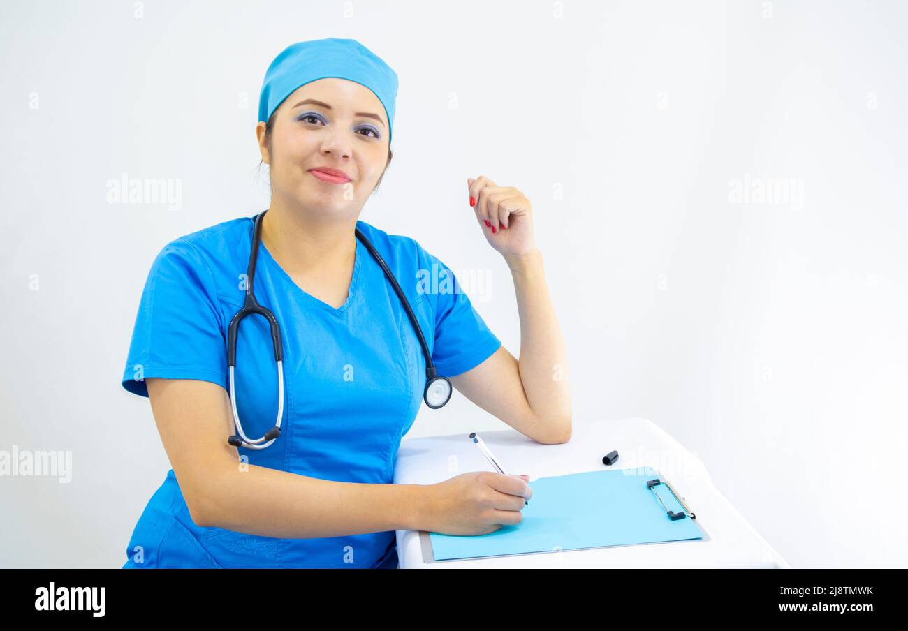 beautiful woman lab technician wearing uniform and blue surgical cap