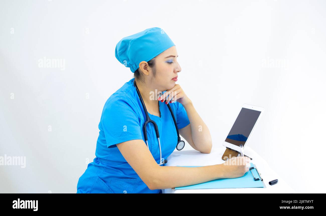 beautiful woman lab technician wearing uniform and blue surgical cap ...