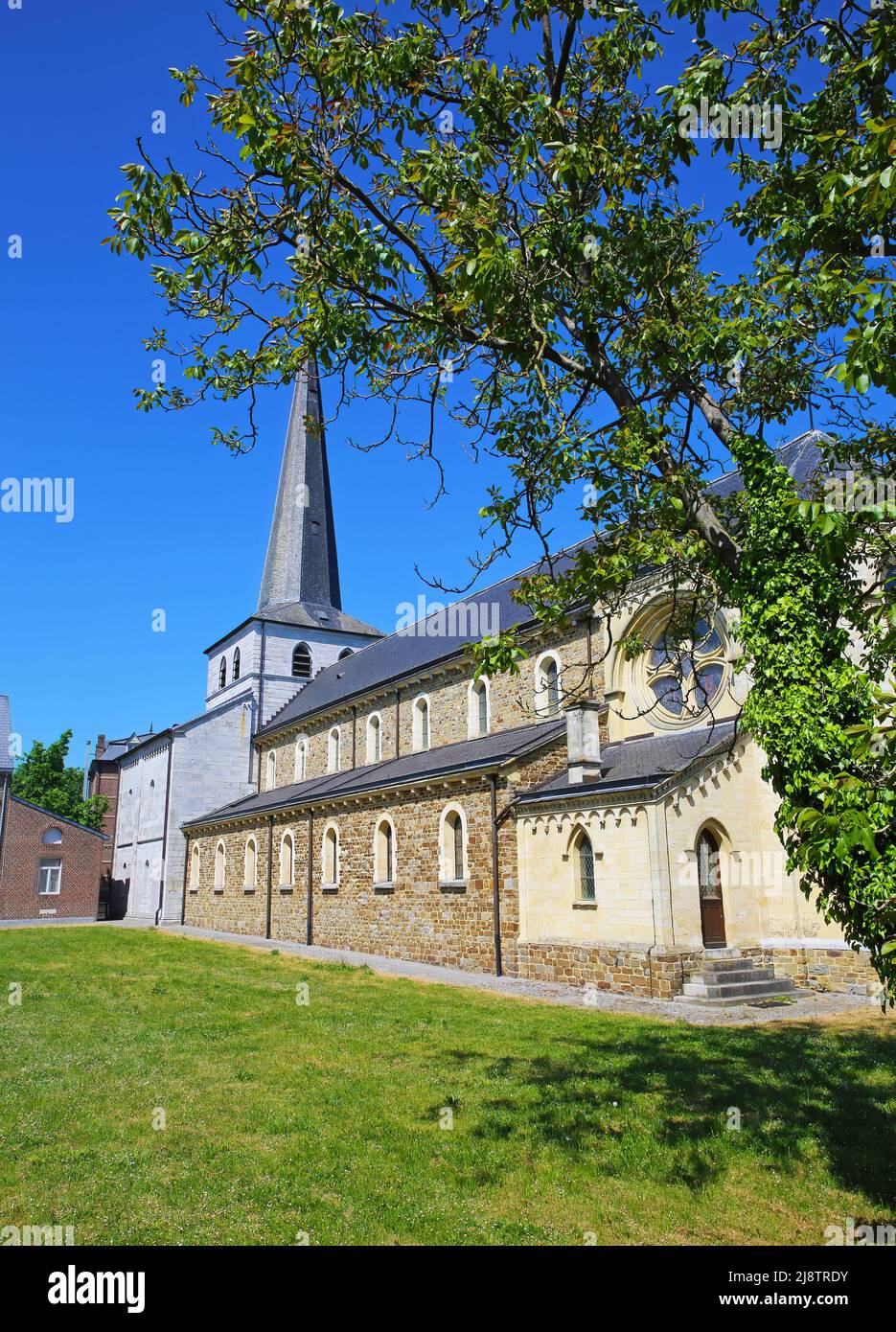 View on former belgian benedictine abbey against blue summer sky - Church of Saint Anne, Aldeneik, Belgium Stock Photo