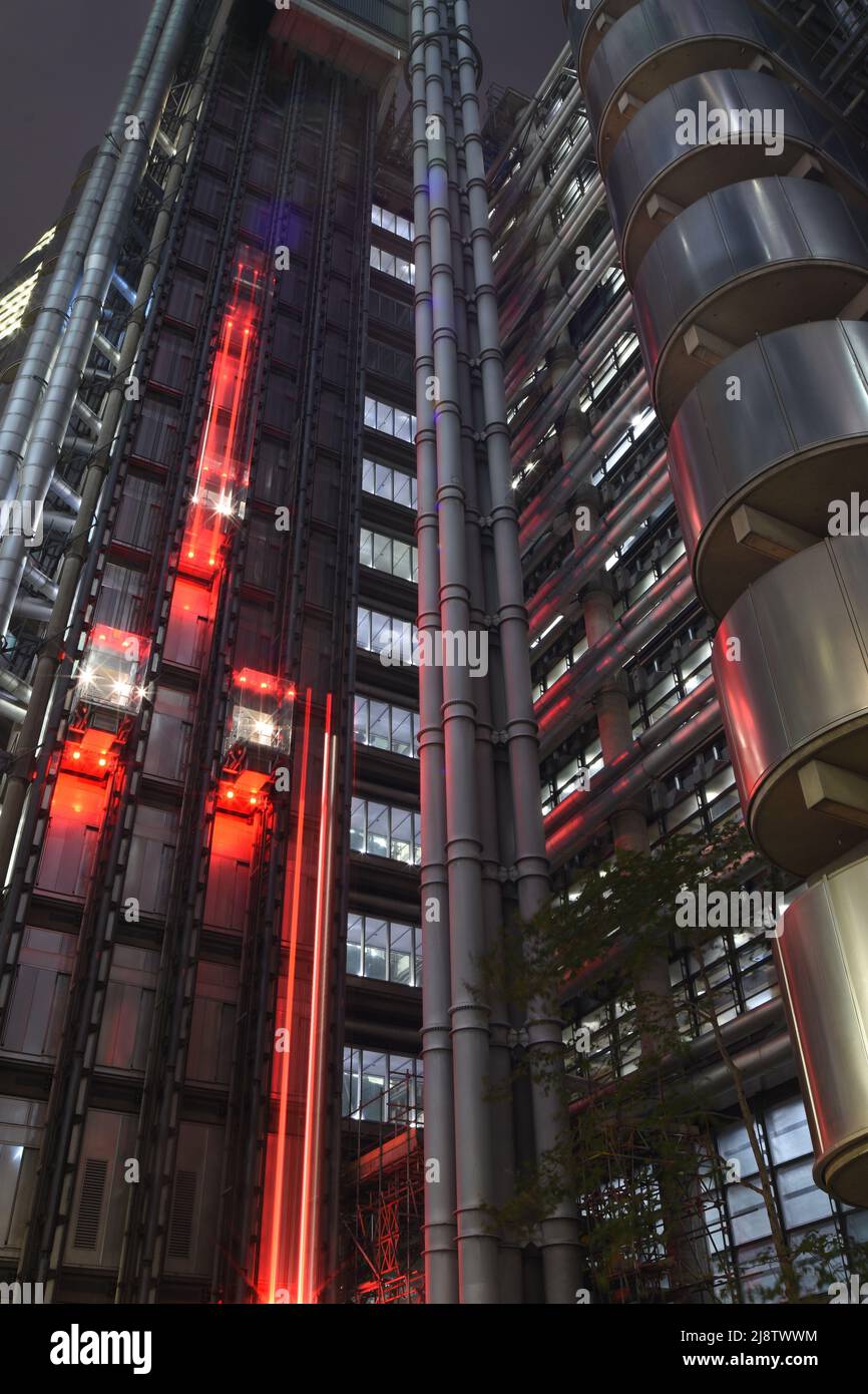 Lloyd's building industrial architecture with moving elevator lights in night time London Stock Photo