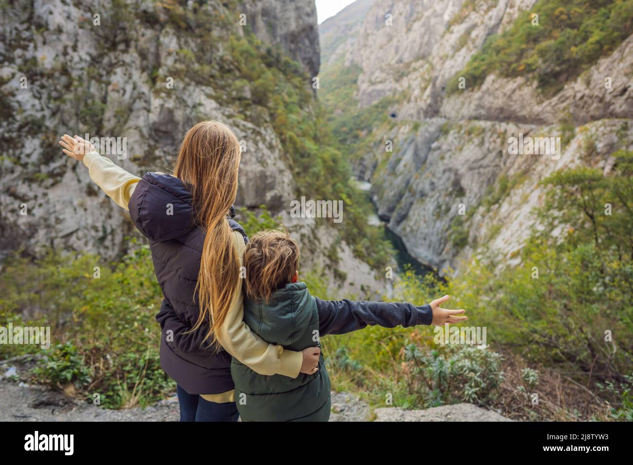 Mom and son tourists in the background of Beautiful Canyon of Moraca river in winter, Montenegro or Crna Gora, Balkan, Europe Stock Photo