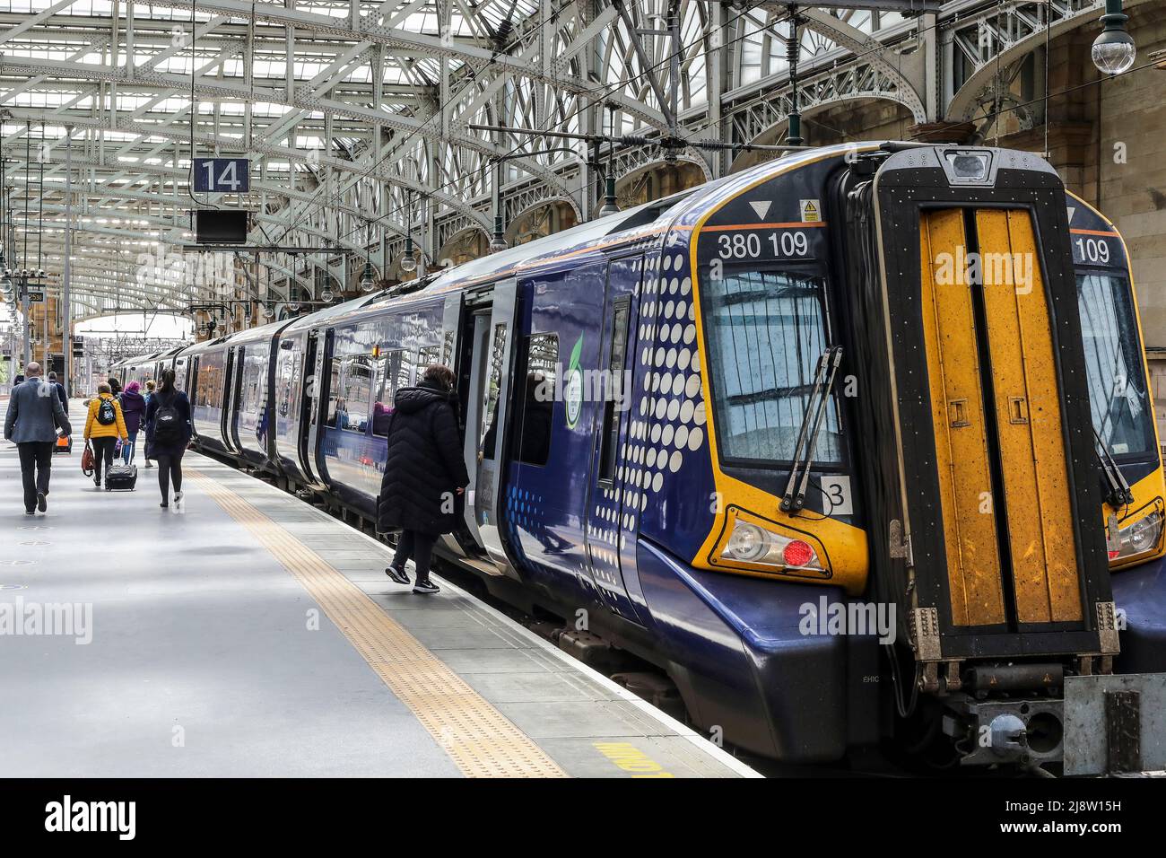 Scotrail electric train at a platform at Glasgow Central station, Glasgow, Scotland, UK Stock Photo