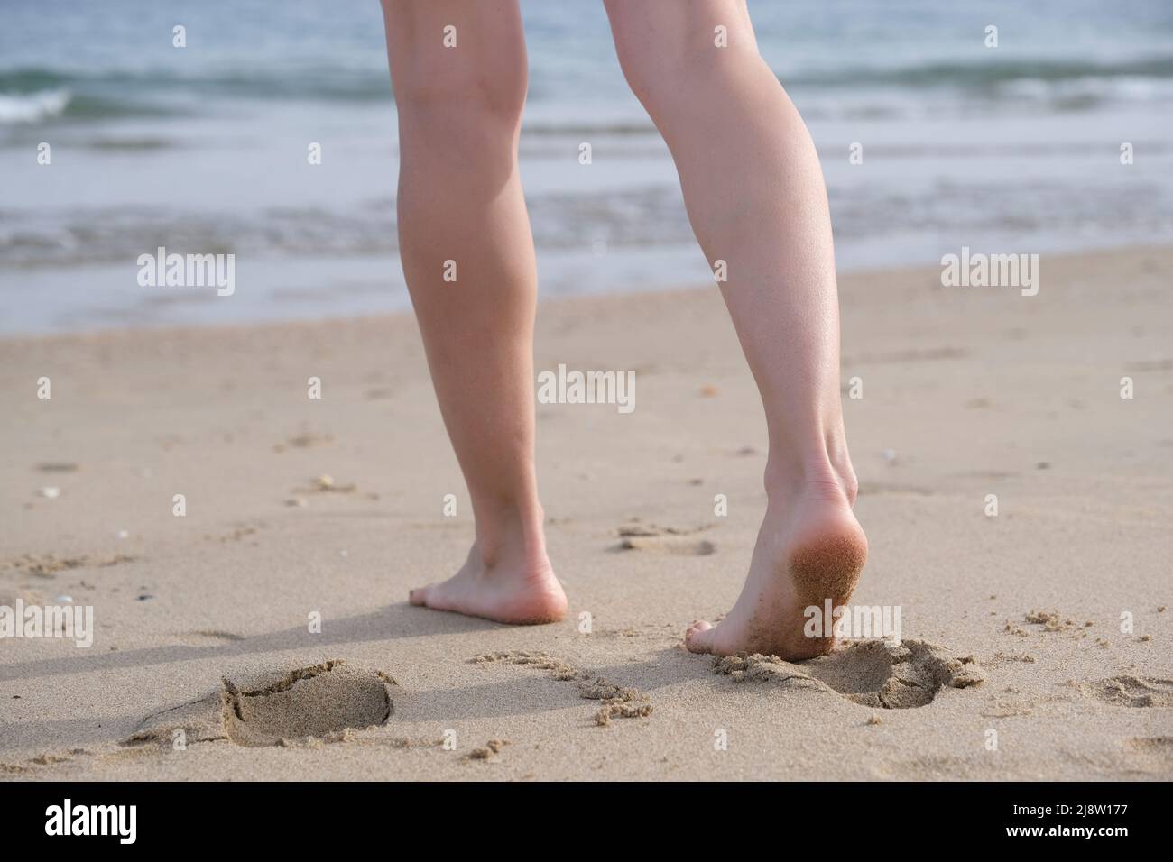 Woman barefoot walking sea hi-res stock photography and images - Alamy