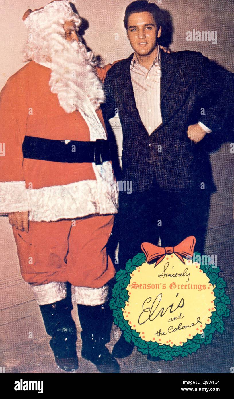 Elvis Presley and Colonel Tom Parker, posing for a Christmas card, circa 1965 File Reference # 34145-833THA Stock Photo