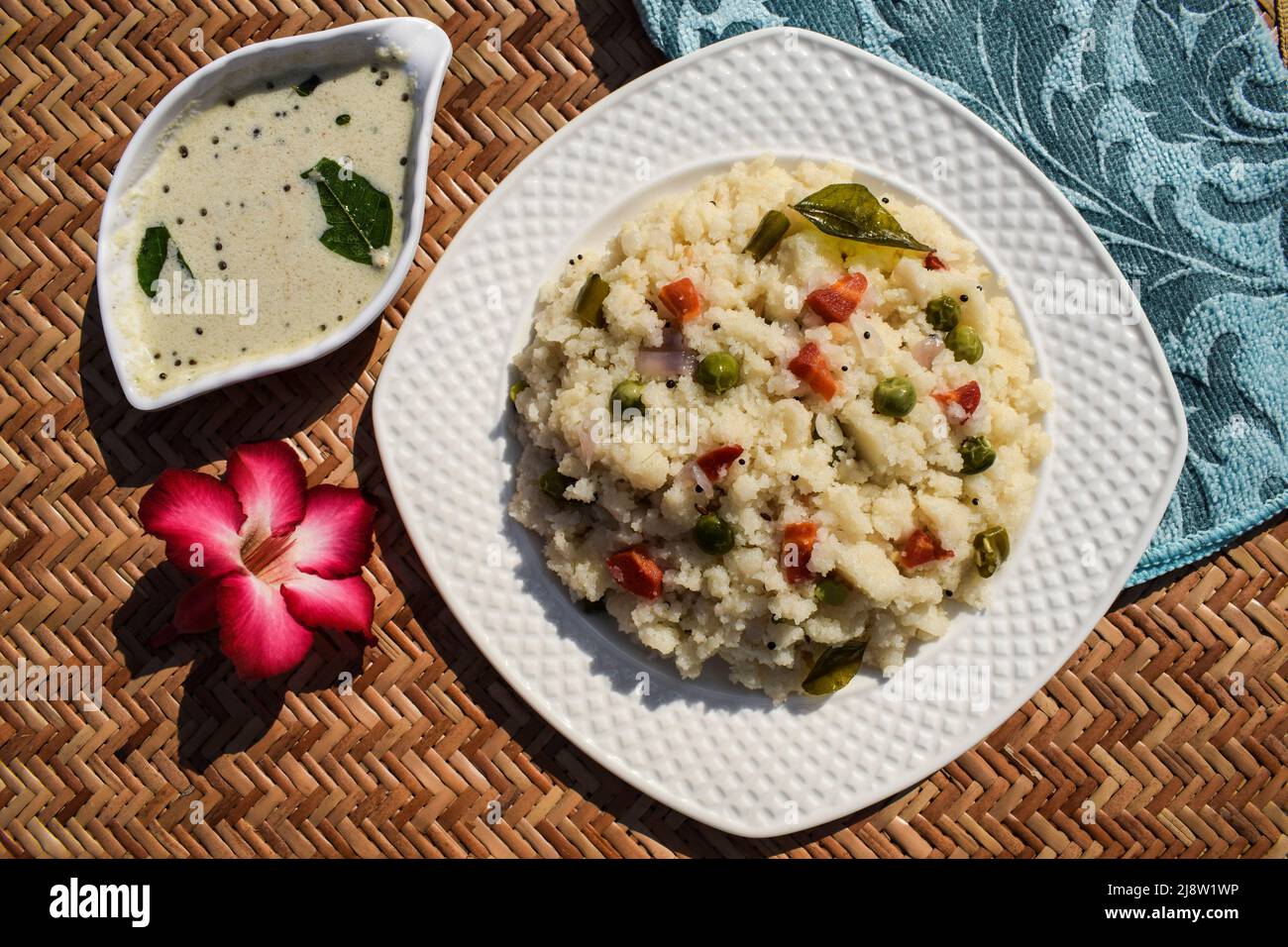 Upma Indian semolina breakfast healthy dish served with white coconut