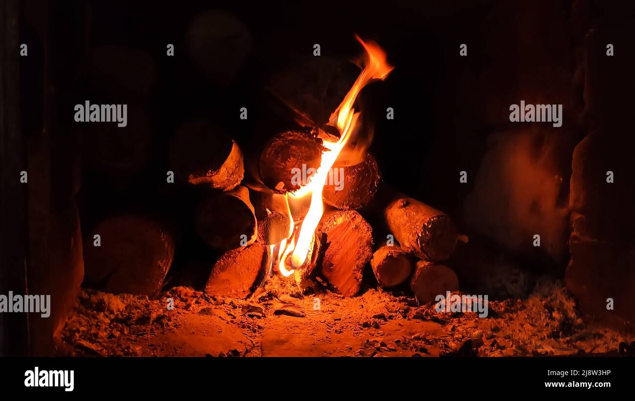 Burning firewood in fireplace in country cottage Stock Photo Alamy