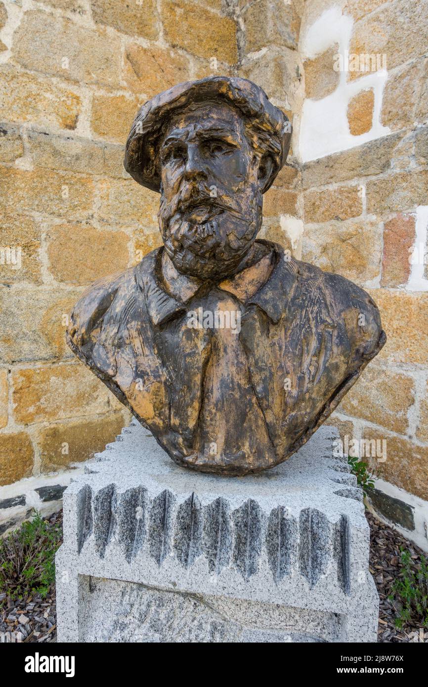 Carved stone bust of the French Impressionist artist Claude Monet who painted many local scenes bordering the river Creuse. Stock Photo