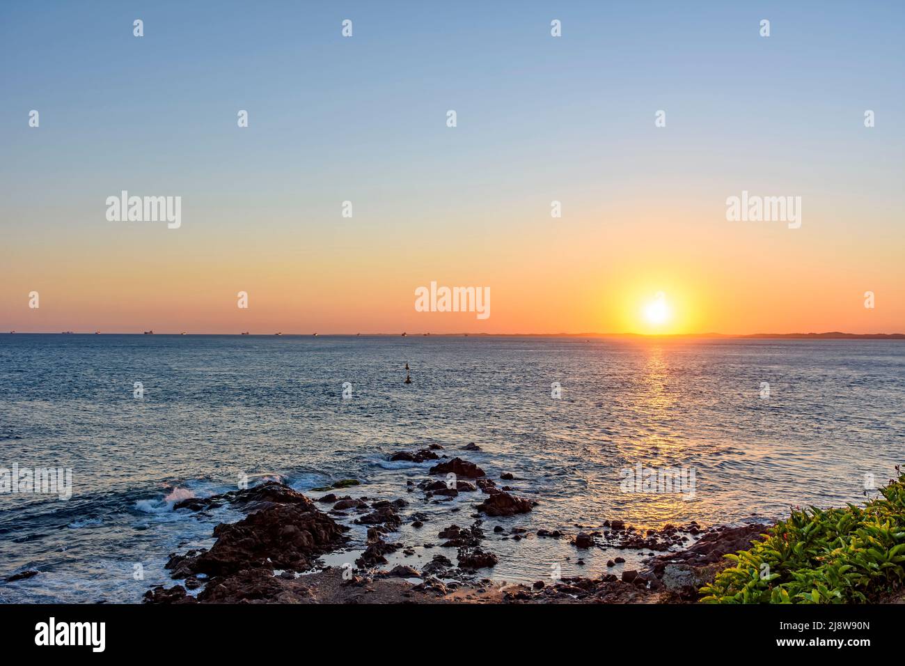 Sunset at Todos os Santos bay in the famous city of Salvador in Bahia northeast coast of Brazil Stock Photo