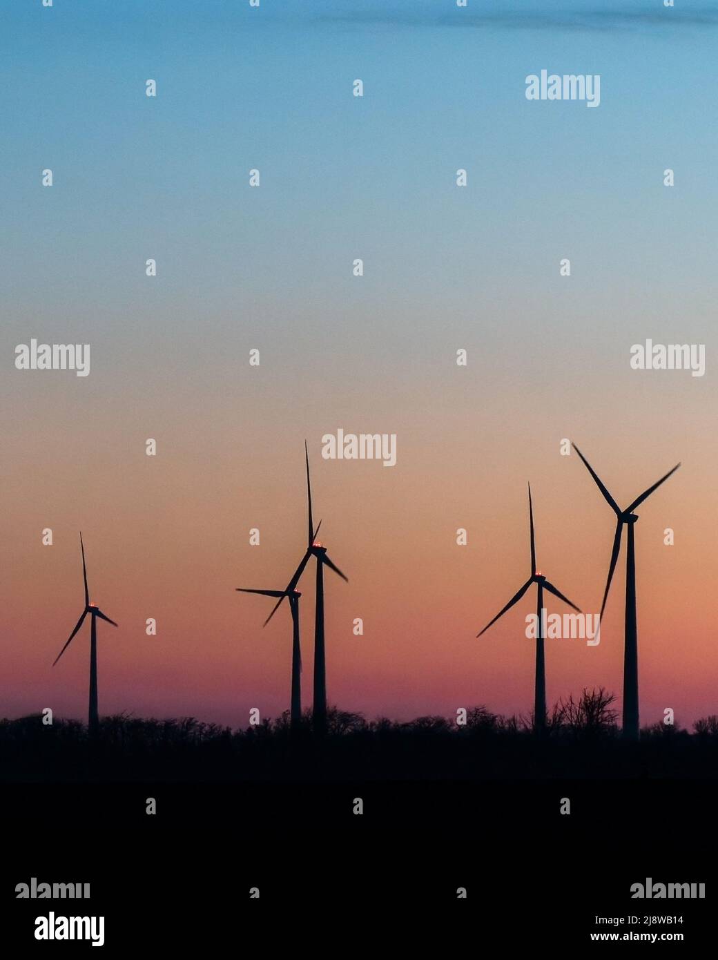 Wind Turbines In Rural Landscape At Sunset. Green renewable and ...
