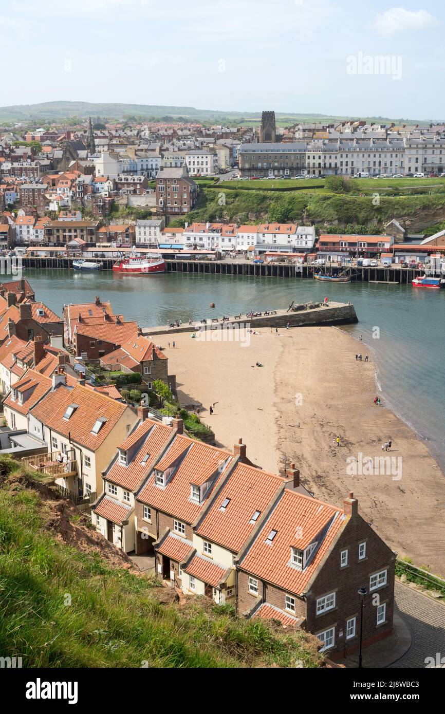 A view looking south across Tate Hill Beach and the river Esk in Whitby, North Yorkshire, England, UK Stock Photo