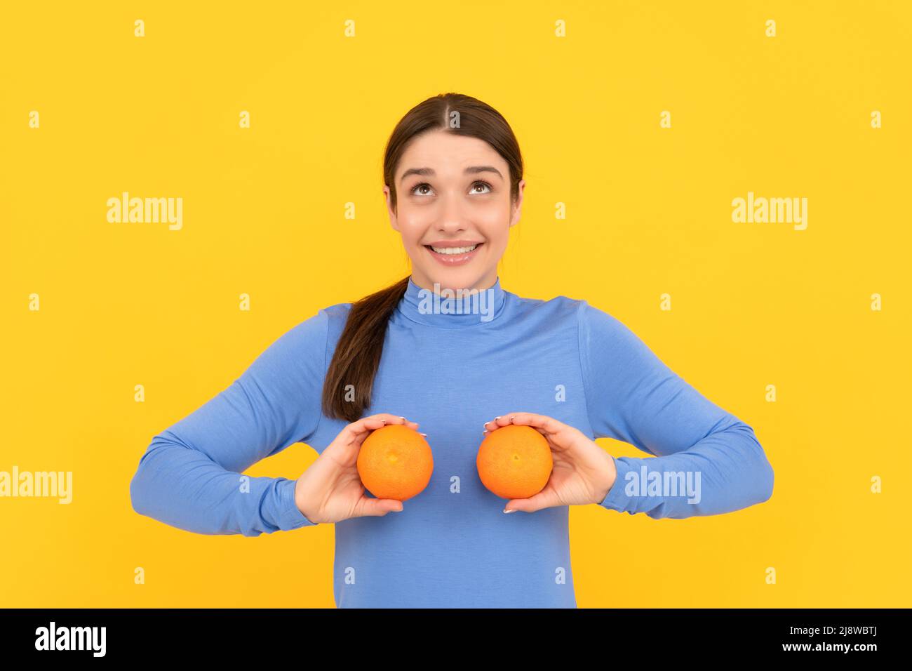 diet and skin beauty. glad girl with orange citrus fruit. vitamin and dieting. Stock Photo