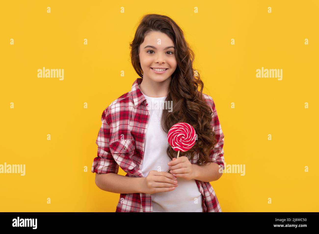 sweet childhood life. teen dental care. sweet tooth. yummy. happy girl hold lollipop. lollipop child Stock Photo