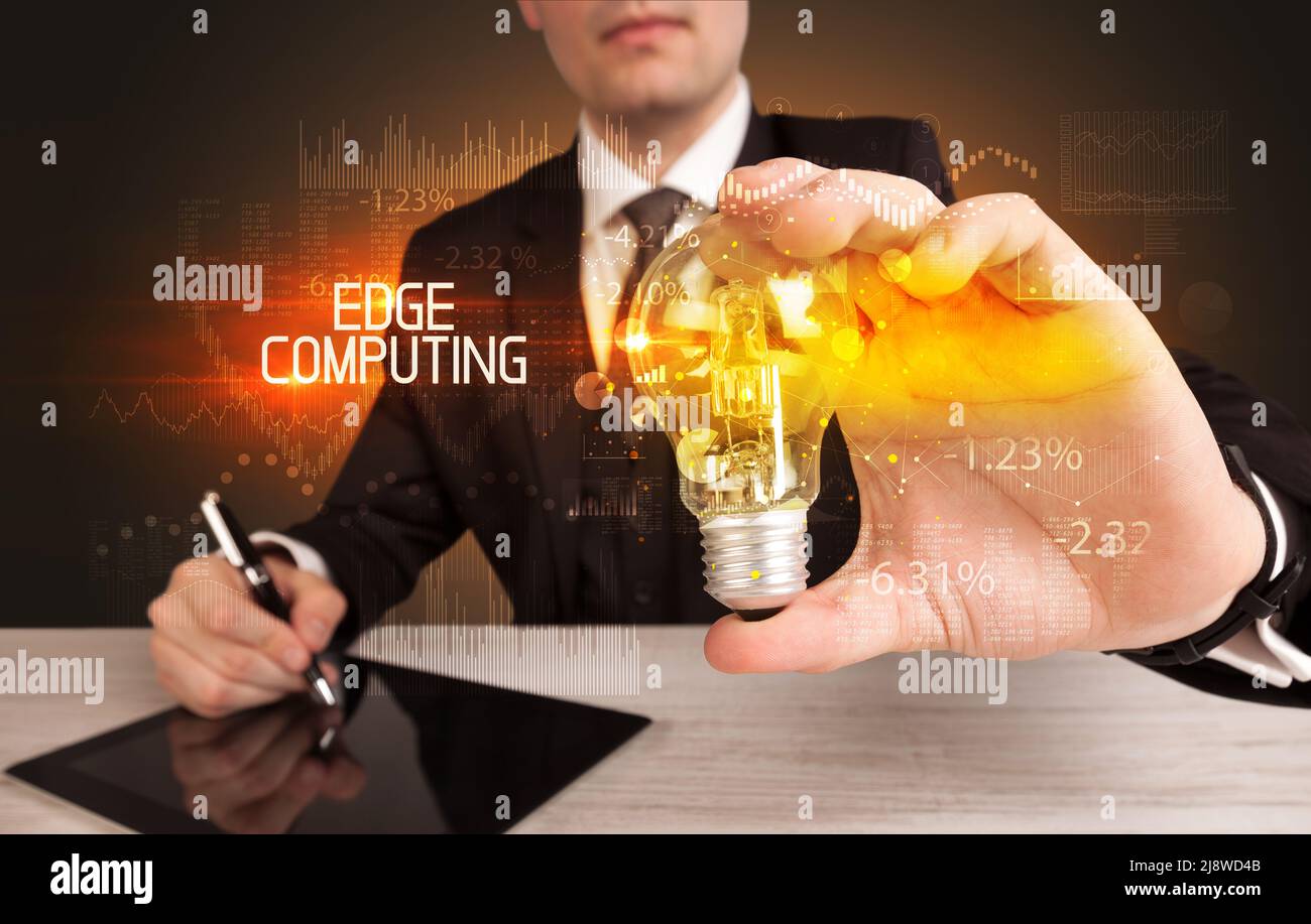 Businessman holding a lightbulb concept Stock Photo - Alamy