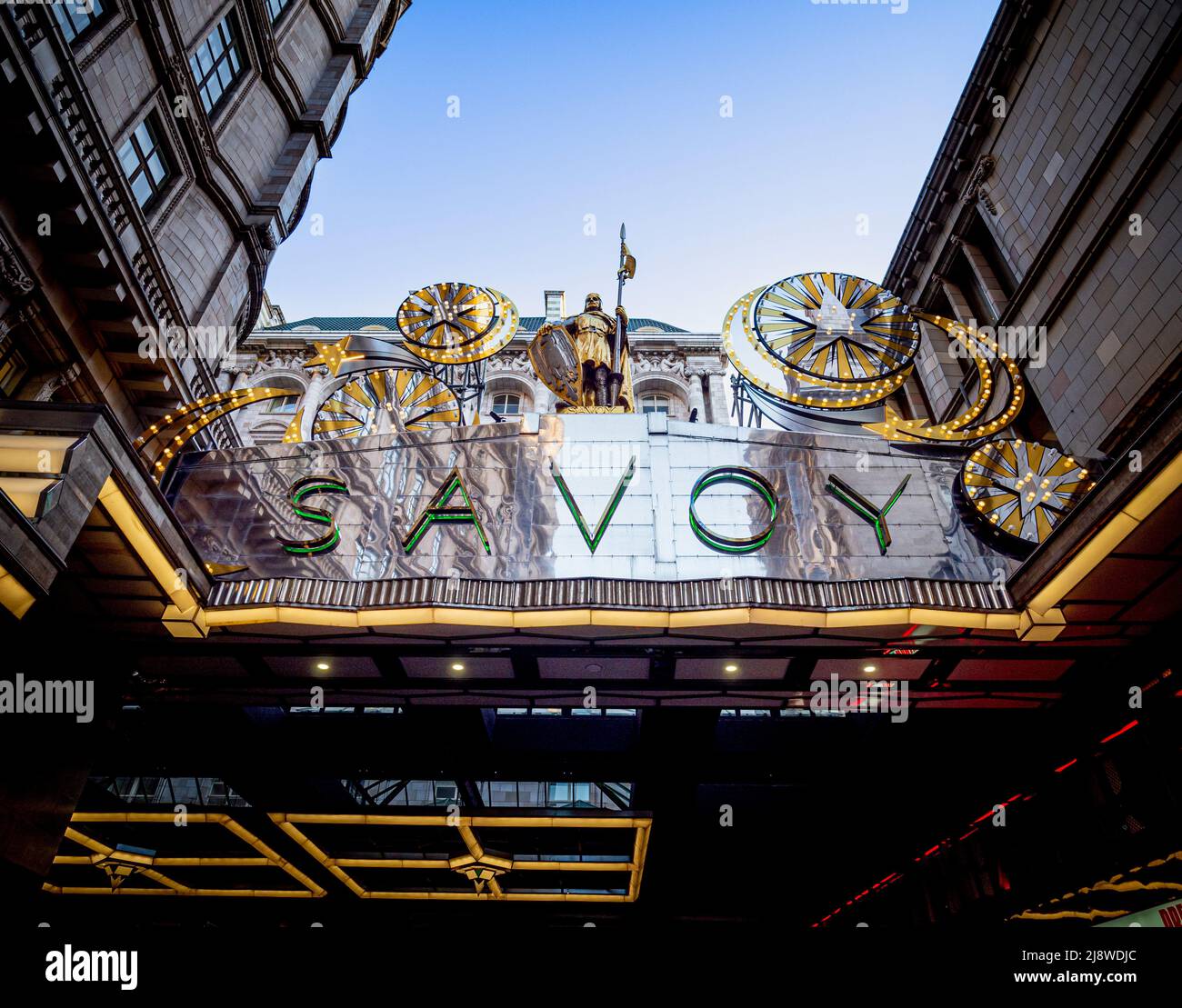 The iconic silver canopy of the Savoy Hotel with illuminated Christmas decorations. London Stock