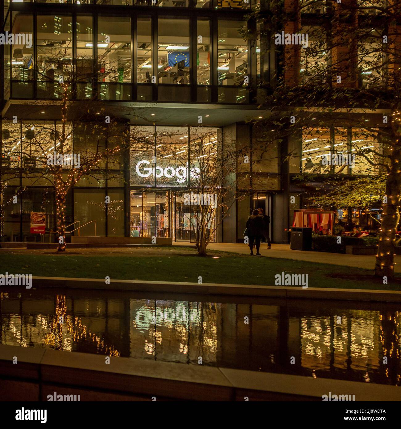 Google offices at night with Chirstmas decorations, Pancras Square, London, UK. Stock Photo