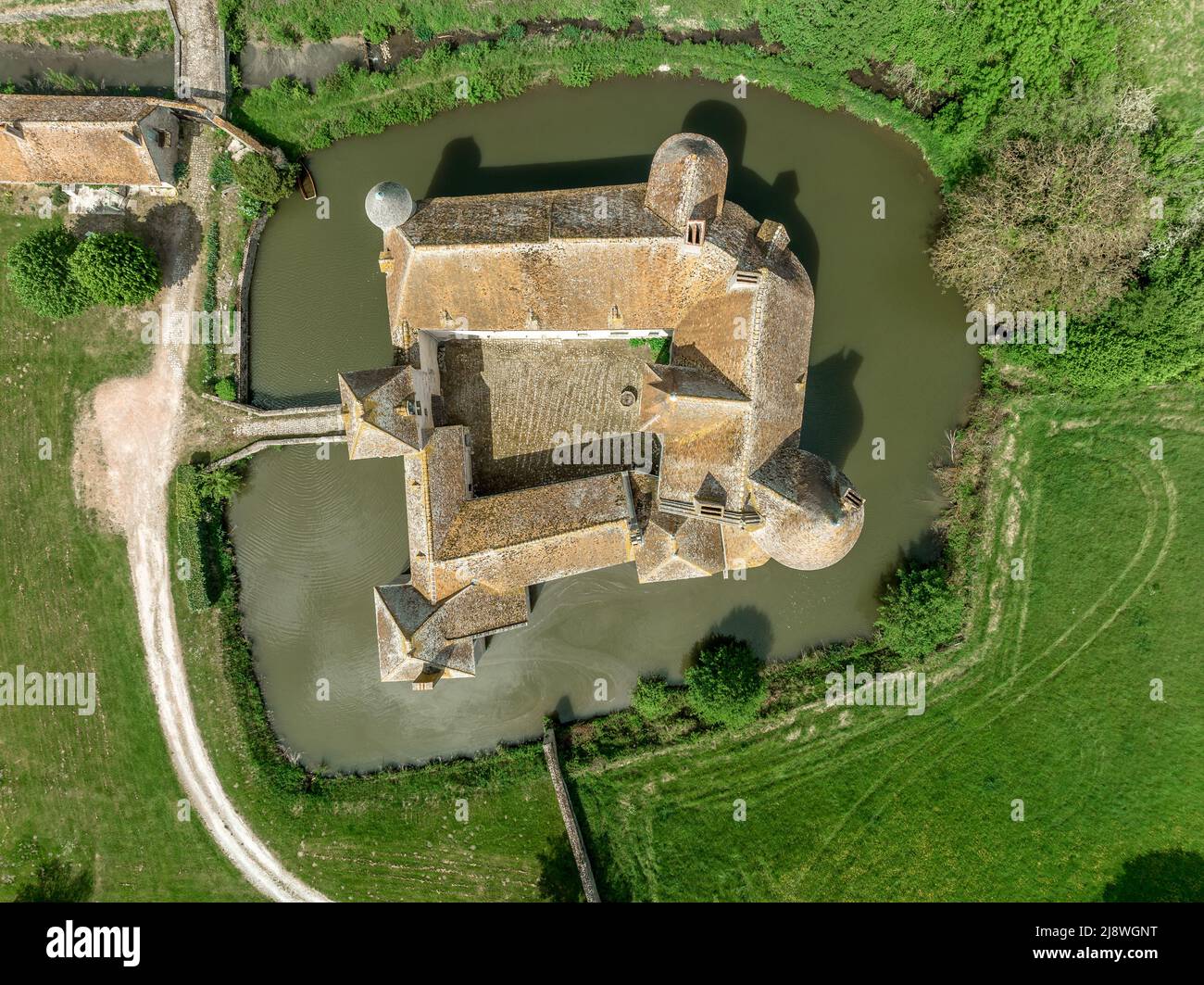 Aerial view of Buranlure water castle in the middle of a lush green meadow in the Loire valley Stock Photo