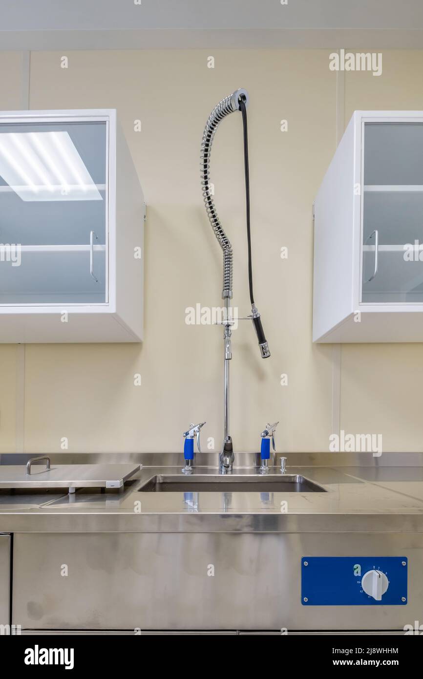 elbow soap and antiseptic dispenser or sanitizer wall mounted for hand