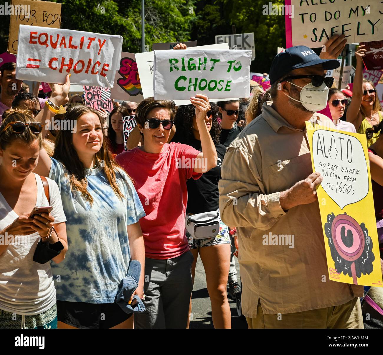 Two marchers holding protest signs about equality and rights during the Roe Bans off our Bodies March and  Rally organized by Planned Parenthood. Stock Photo