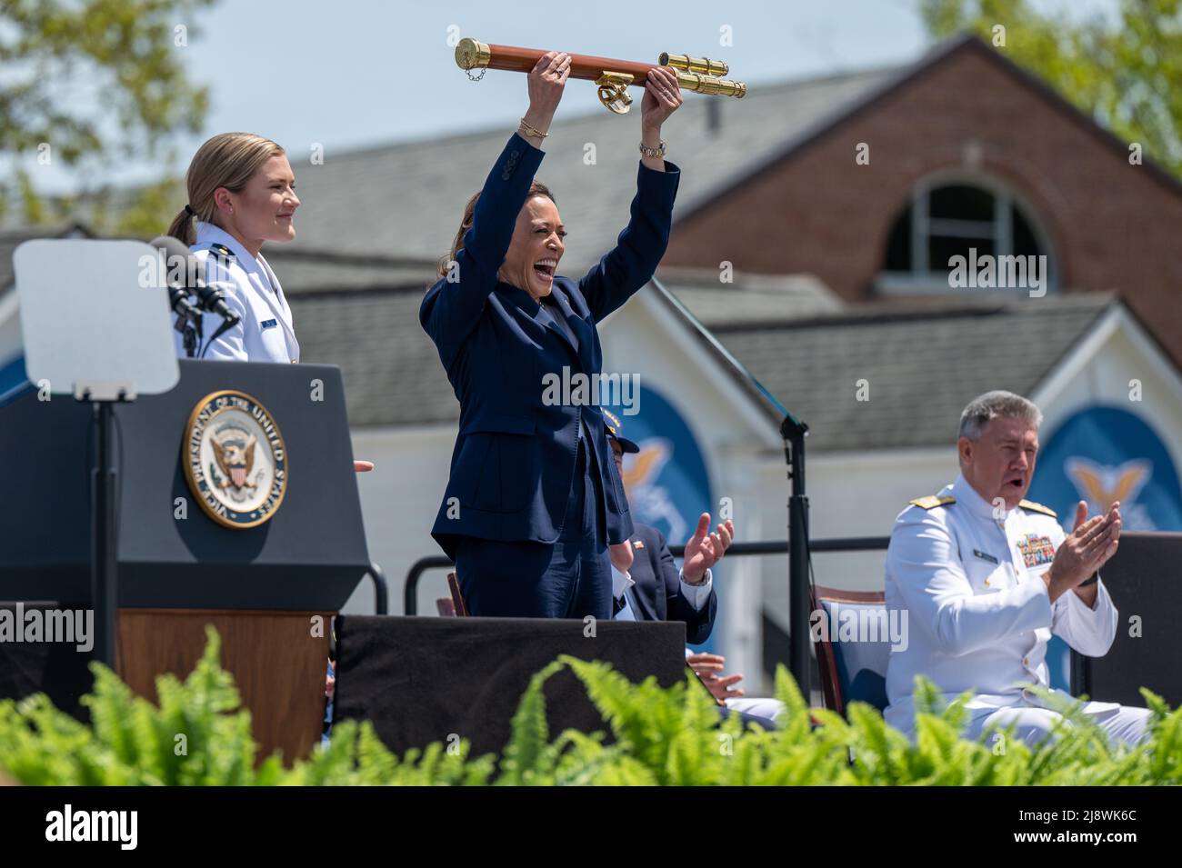 New London, United States of America. 18 May, 2022. U.S. Vice President Kamala Harris, lifts the school scepter over her head to mark the end of the 141st Commencement ceremony at the Coast Guard Academy, May 18, 2022 in New London, Connecticut. The Coast Guard Academy graduated 252 new officers along with nine international students. Credit: David Lau/U.S. Coast Guard Photo/Alamy Live News Stock Photo