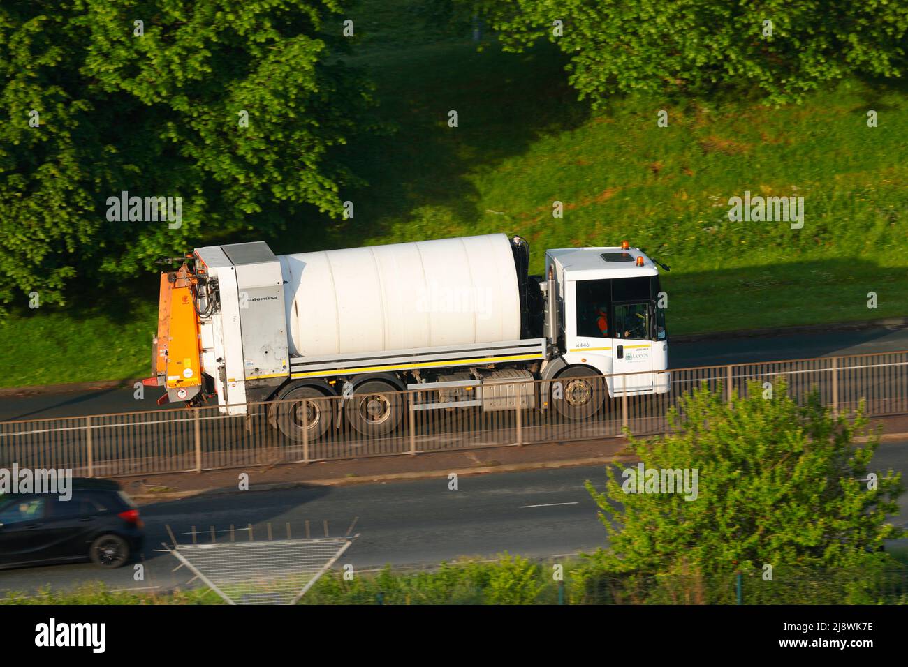 An elevated view of a waste collection truck owned by Leeds City