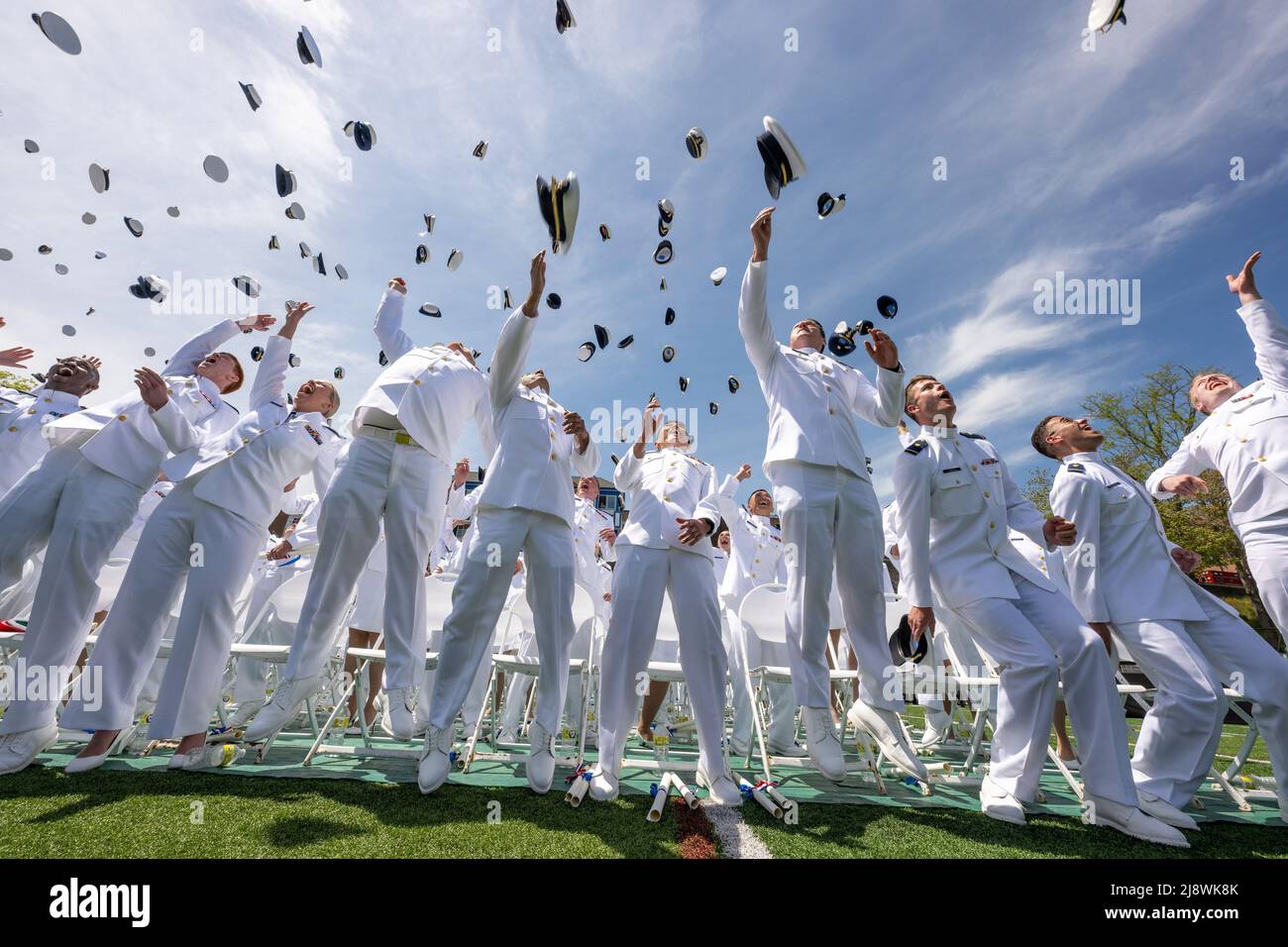 New London, United States of America. 18 May, 2022. U.S. Coast Guard Academy graduates toss their hats into the air to celebrate the conclusion of the 141st Commencement Ceremony at the Coast Guard Academy, May 18, 2022 in New London, Connecticut. The Coast Guard Academy graduated 252 new officers along with nine international students. Credit: David Lau/U.S. Coast Guard Photo/Alamy Live News Stock Photo