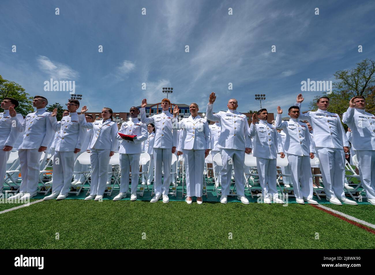 New London, United States of America. 18 May, 2022. U.S. Coast Guard Academy graduates take the oath of commission at the conclusion of the 141st Commencement Ceremony at the Coast Guard Academy, May 18, 2022 in New London, Connecticut. The Coast Guard Academy graduated 252 new officers along with nine international students. Credit: David Lau/U.S. Coast Guard Photo/Alamy Live News Stock Photo