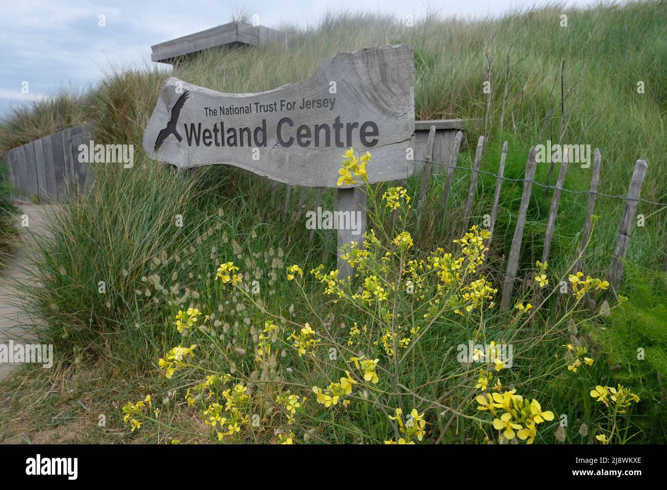Carved wooden sign for entrance to the Jersey Wetland Centre bird hide, Five Mile Road, St Ouens Pond, St Ouens Bay, Jersey, Channel Islands Stock Photo