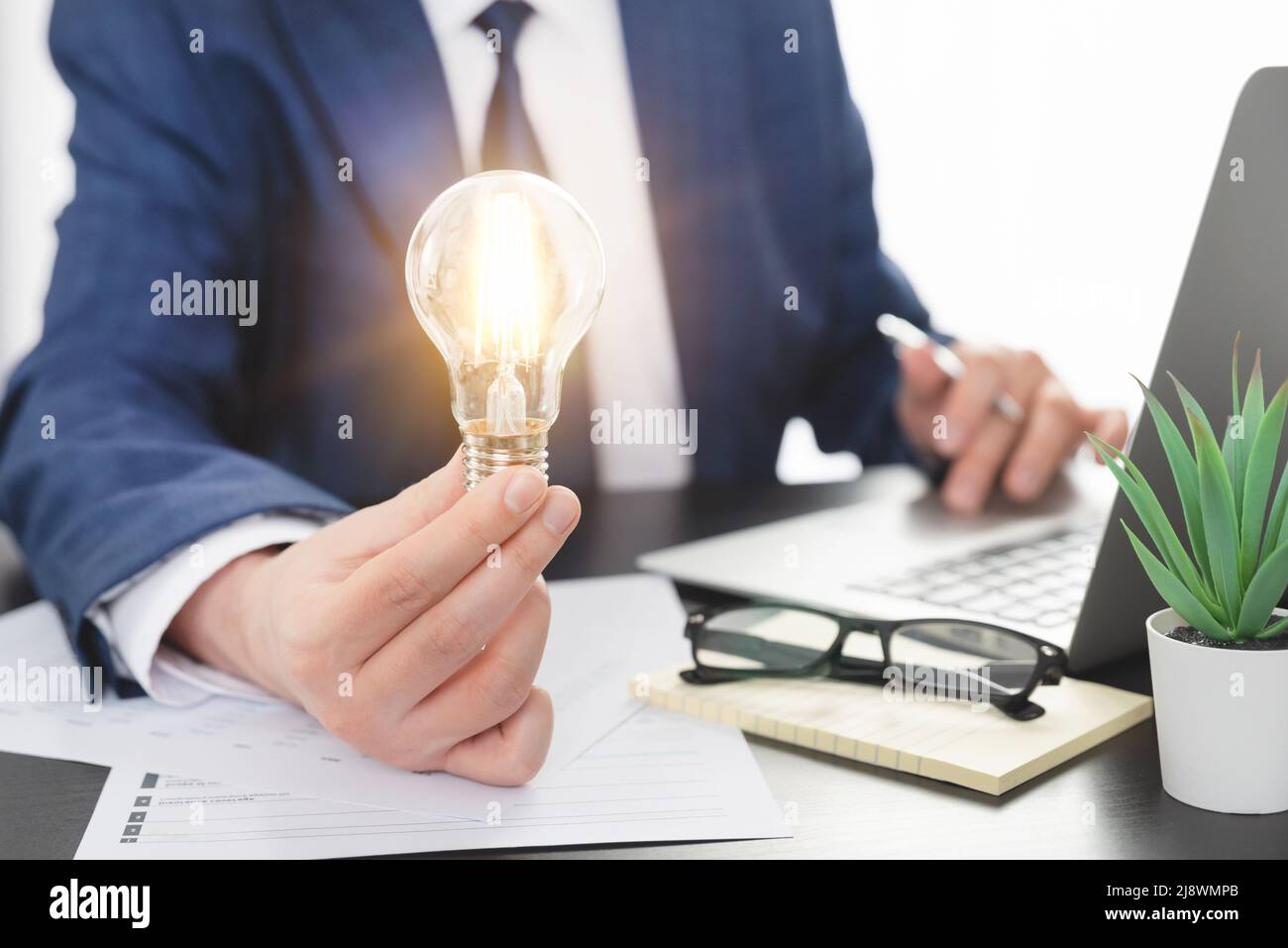 Business, creative idea concept. Businessman holding light bulb Stock ...