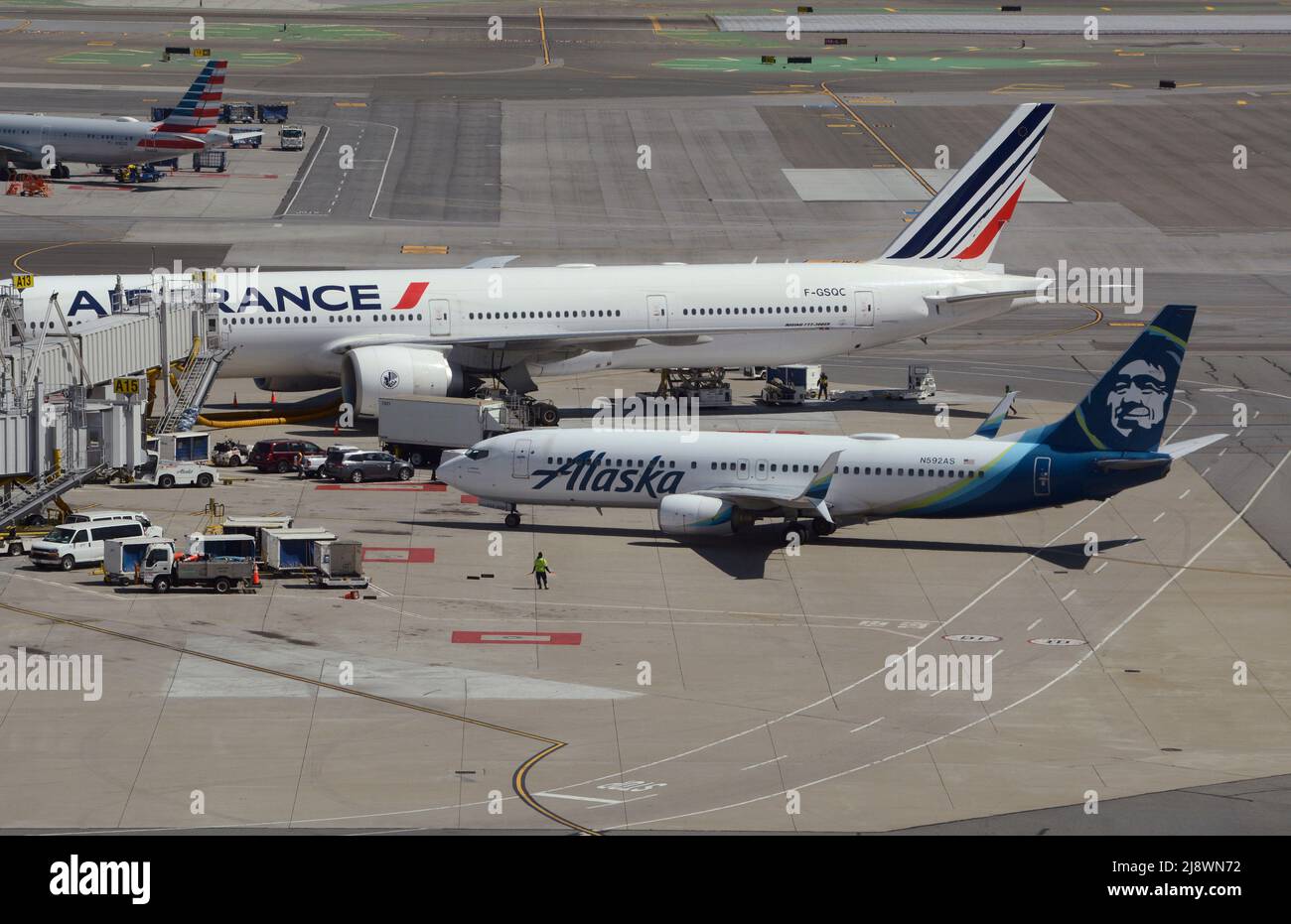Alaska Airlines and Air France passenger planes at their gates at San