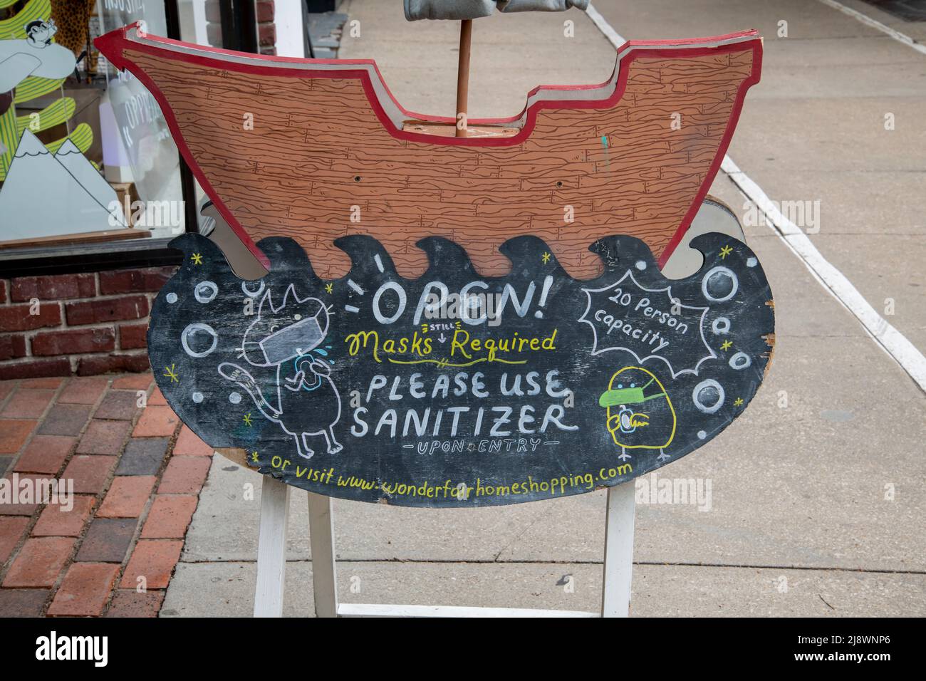 Lawrence, Kansas. Facemasks and sanitizers are still required sign in Art store after the government lifted the mask requirement. Stock Photo
