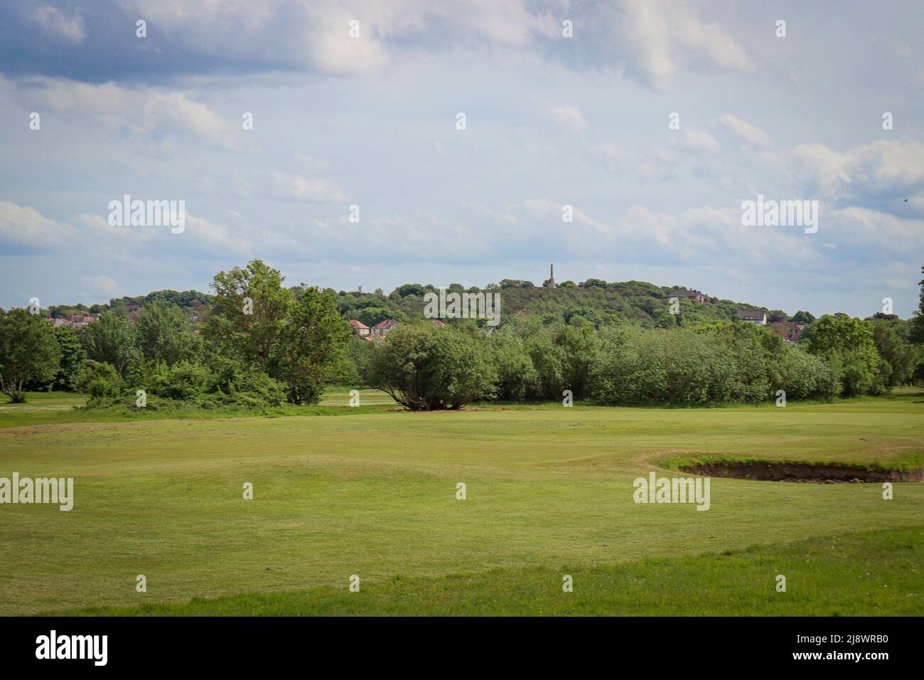 View of Column Hill, Mariners' Beacon across Hoylake Municipal Golf Course Stock Photo
