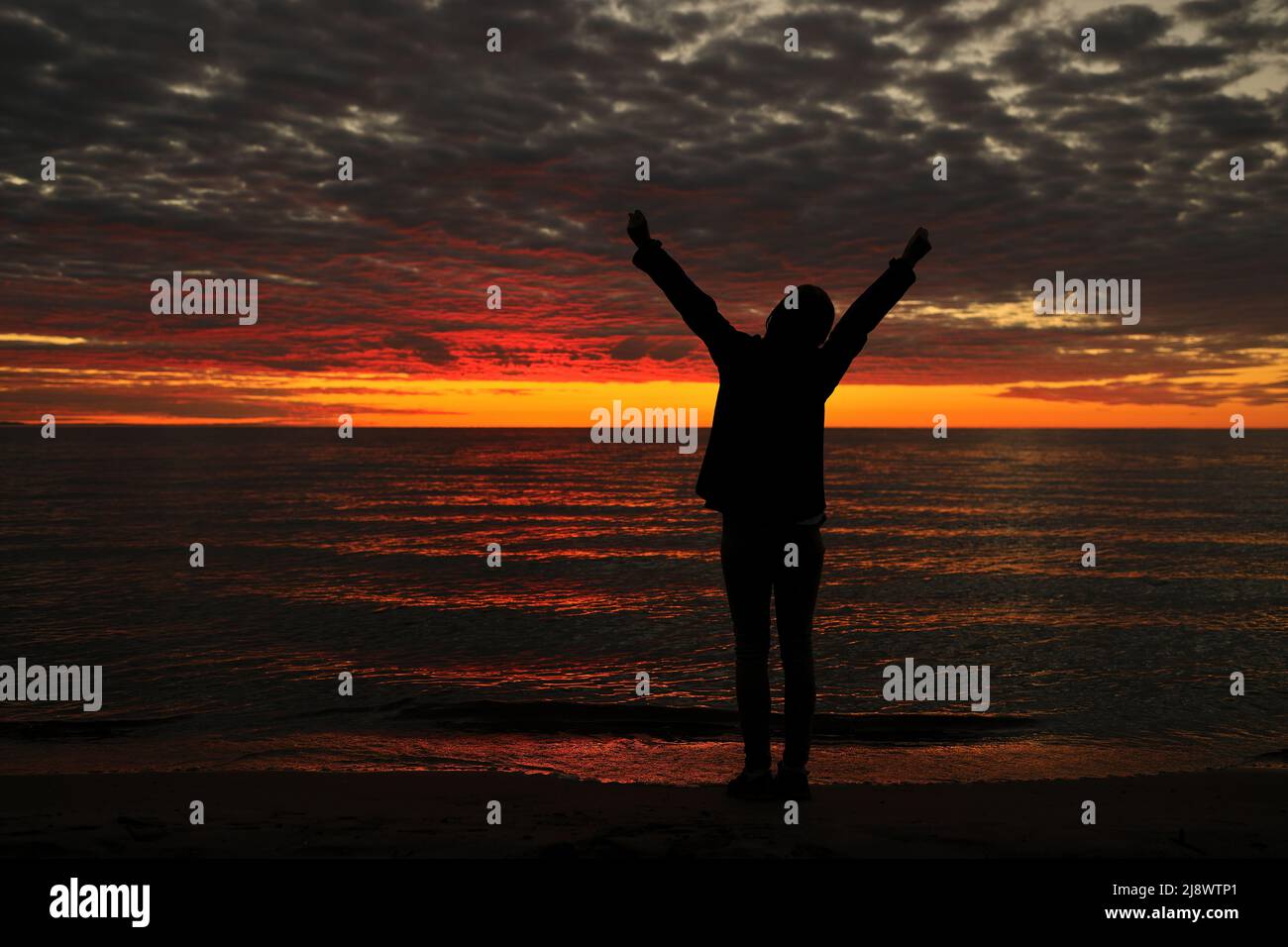 Woman silhouette arms up hi-res stock photography and images - Alamy