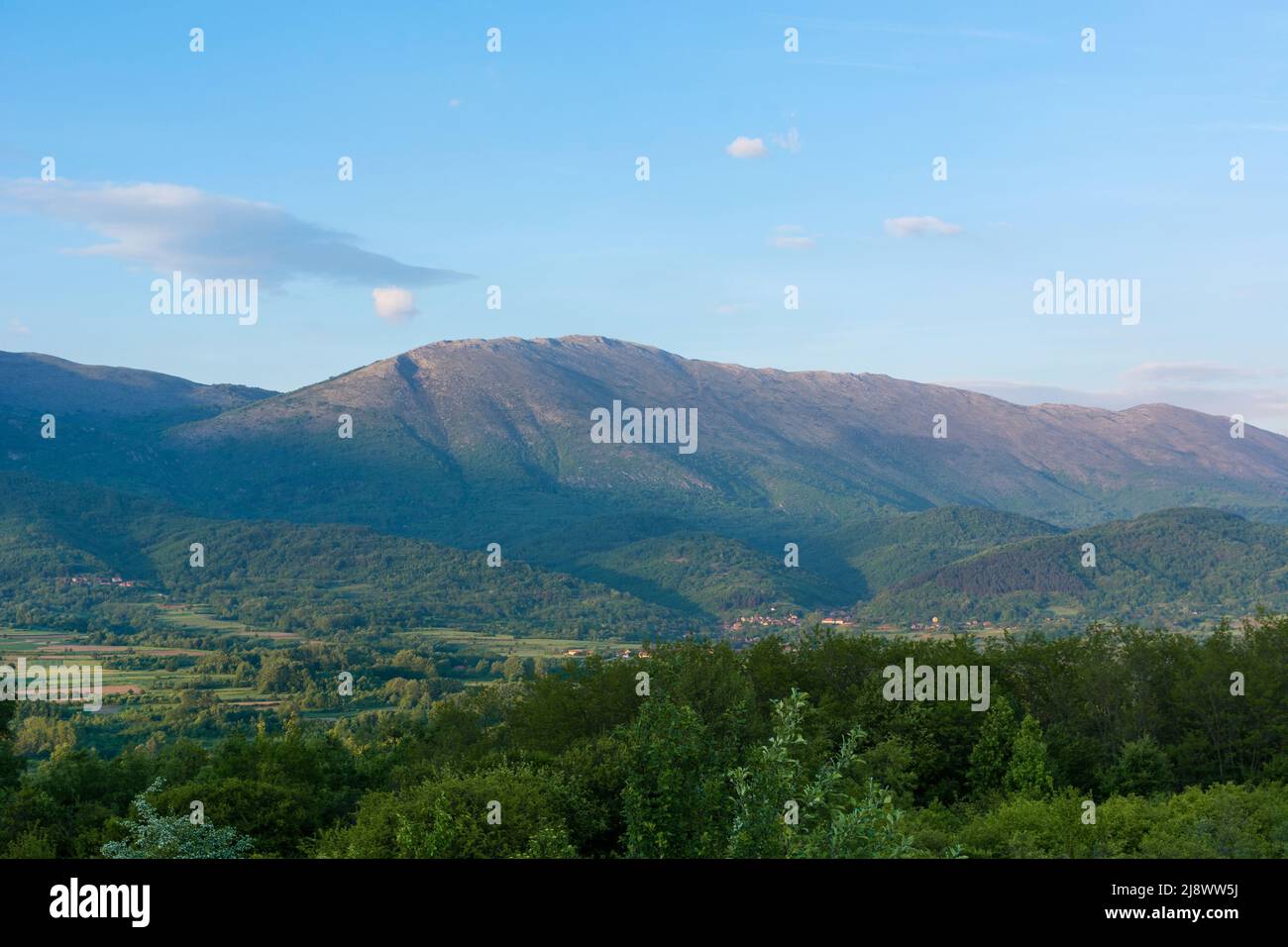 Top mountain range at spring sunset. Image of a beautiful winter landscape in the south of Serbia. Suva Planina mountain. Natural background concept Stock Photo