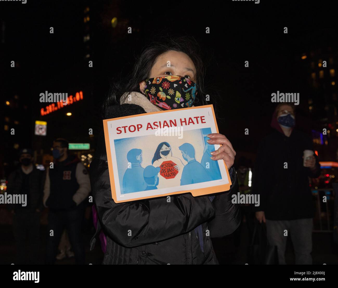 NEW YORK, N.Y. – March 19, 2021: A demonstrator is seen in Union Square Park during a vigil for victims of anti-Asian violence. Stock Photo